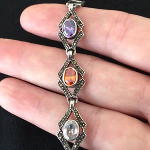 Silver link bracelet w/multicolored stones